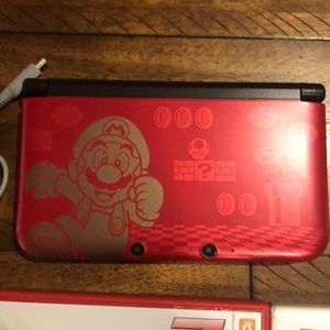 Nintendo 3DS XL game console with games/ charger